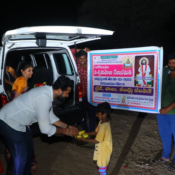 Aumaujaya Devotees Distributing Fruits.